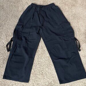 Trendy black cargo pants with a relaxed, wide-leg fit